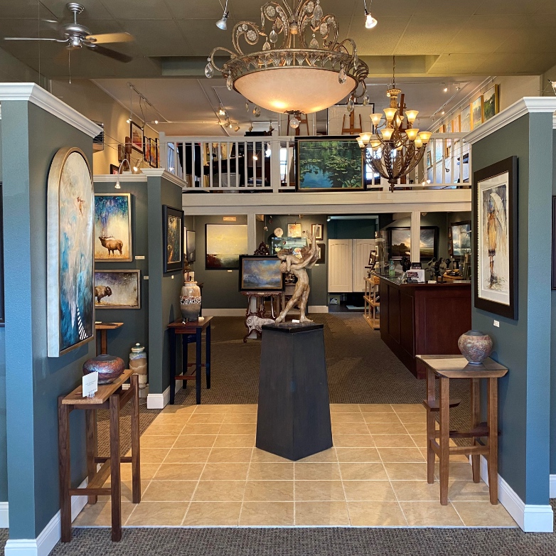 Interior of the Cole Gallery & Studio with a sculpture and paintings on the wall in Edmonds WA