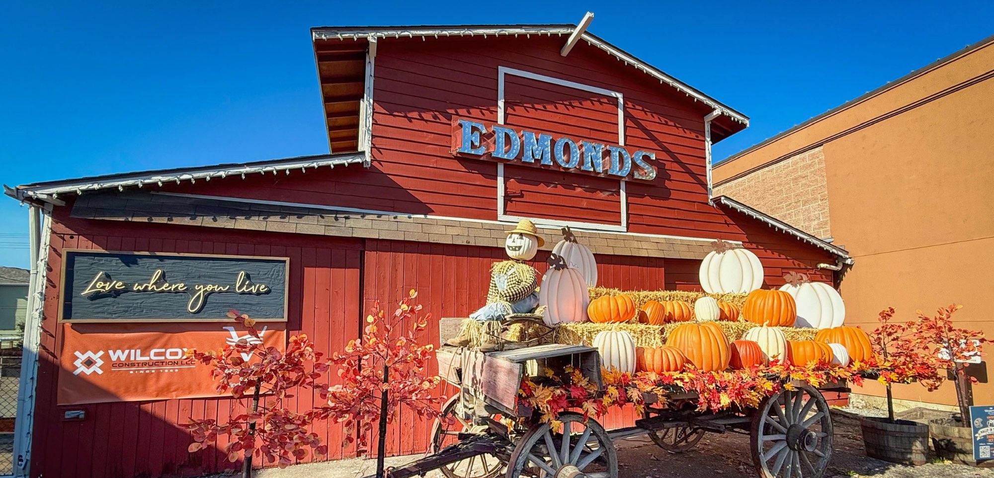 Red Barn in Edmonds with a wagon holding pumpkins on it as a photo opportunity