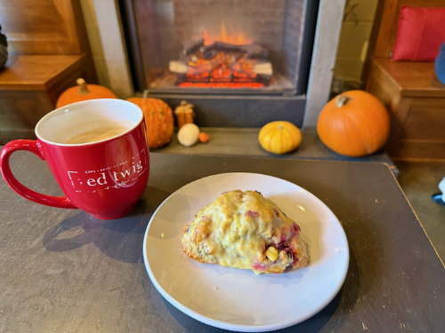 Coffee and a scone in front of a fireplace in Red Twig in Edmonds